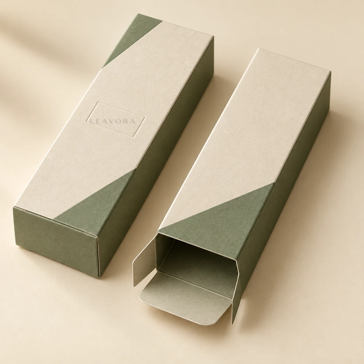 Close-up concept of restrained embossed LEAVORA branding on a folding carton.